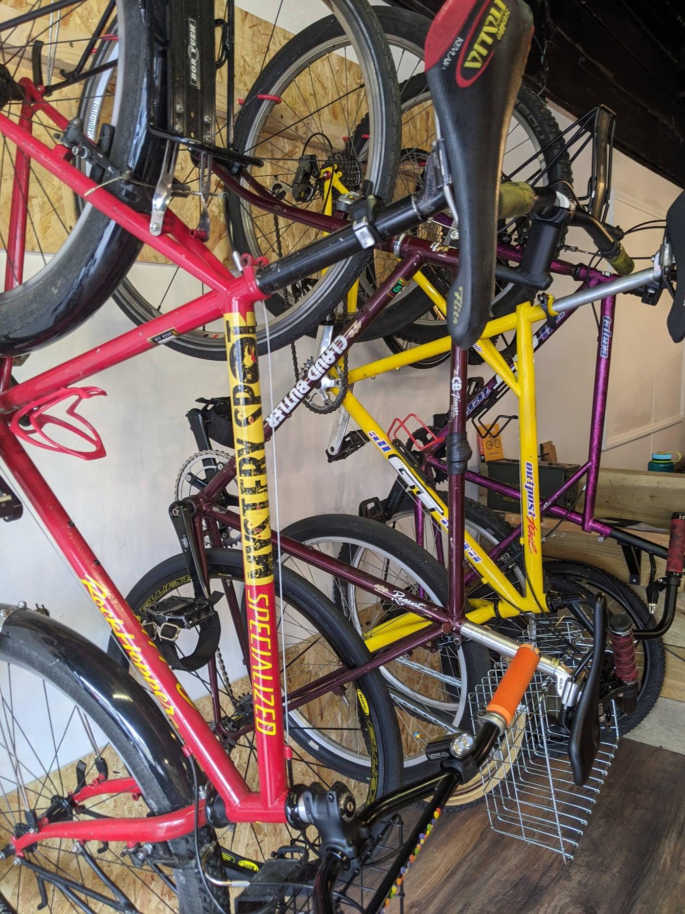Bikes racked on the wall of the June 2023 pop-up shop — placeholder photo